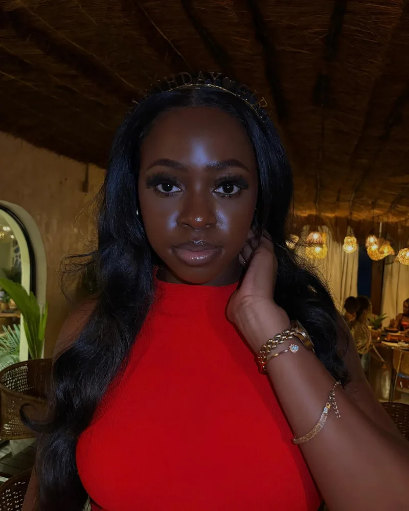 Worthy celebrating her birthday in a red dress